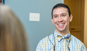 Doctor Parry smiling at a patient