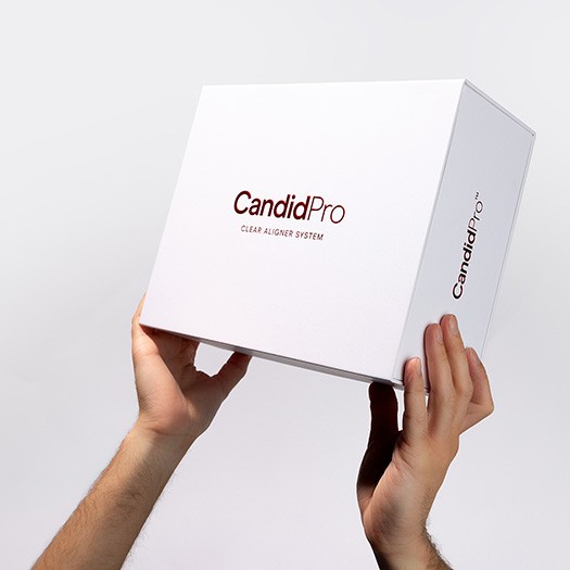 person holding a candid pro box
