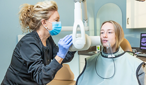 Dental patient getting her teeth scanned