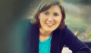 Smiling woman in a dark blue blazer