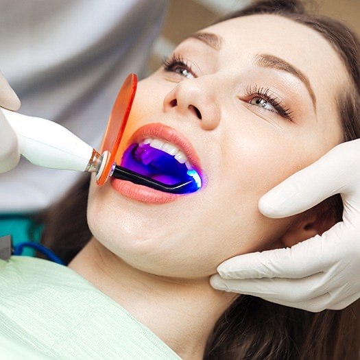 Woman receiving dental bonding treatment