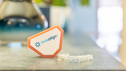 Clear aligner resting on a countertop