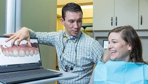 Doctor Parry showing a patient a digital impression of their teeth