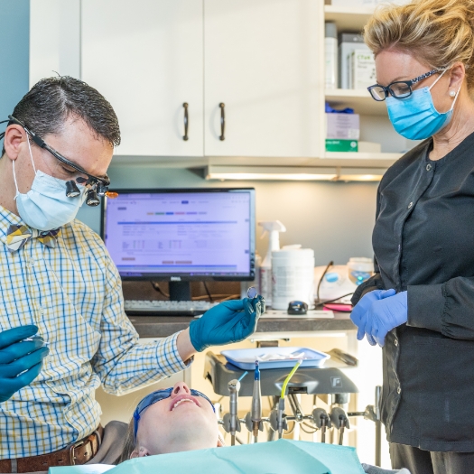 dental crown being placed over bottom tooth