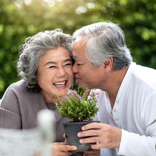 An older couple enjoys each other’s company after receiving their customized dentures in Summerfield