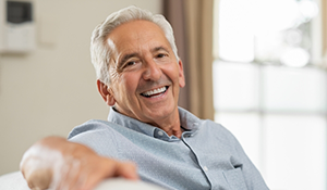 Smiling man sitting on a couch