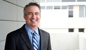 Man smiling in a suit