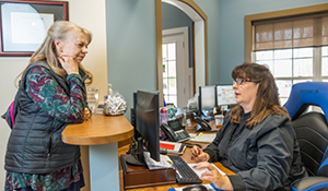 Woman checking in at the dental office