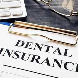 Dental insurance form on clipboard 