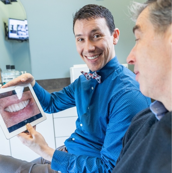 doctor showing patient a smile