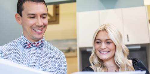 Doctor Parry showing papers to a patient