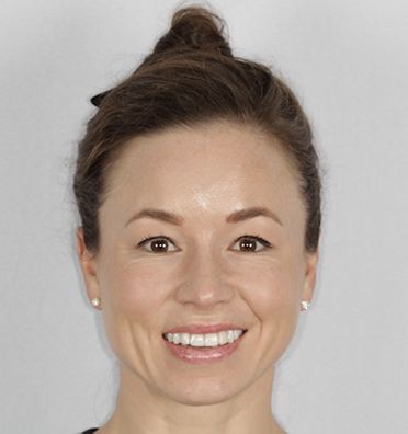 Smiling woman holding a bouquet of flowers