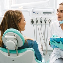 A dentist treating a sedated patient