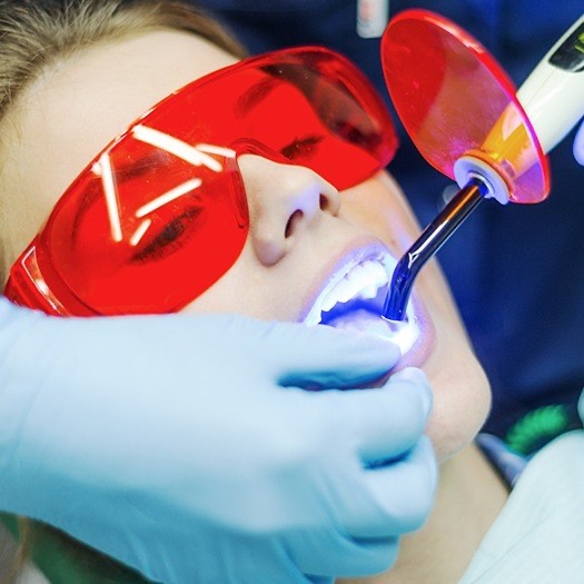 Patient receiving dental sealants