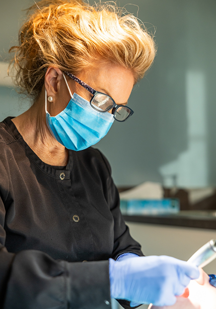 Dental professional treating a patient