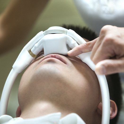 Patient with nitrous oxide sedation dentistry mask in place