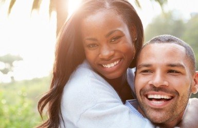 Man and woman smiling after cosmetic dentistry