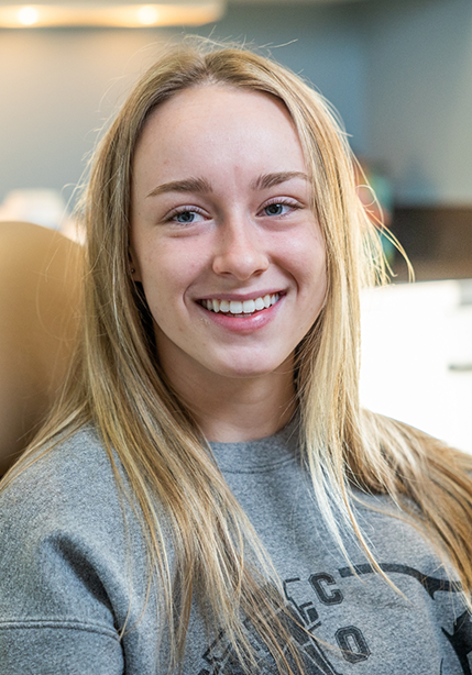 Blonde woman smiling in the dental chair