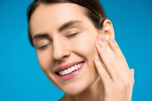 Woman choosing veneers or crowns