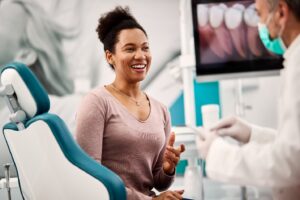 Dental patient talking to her dentist